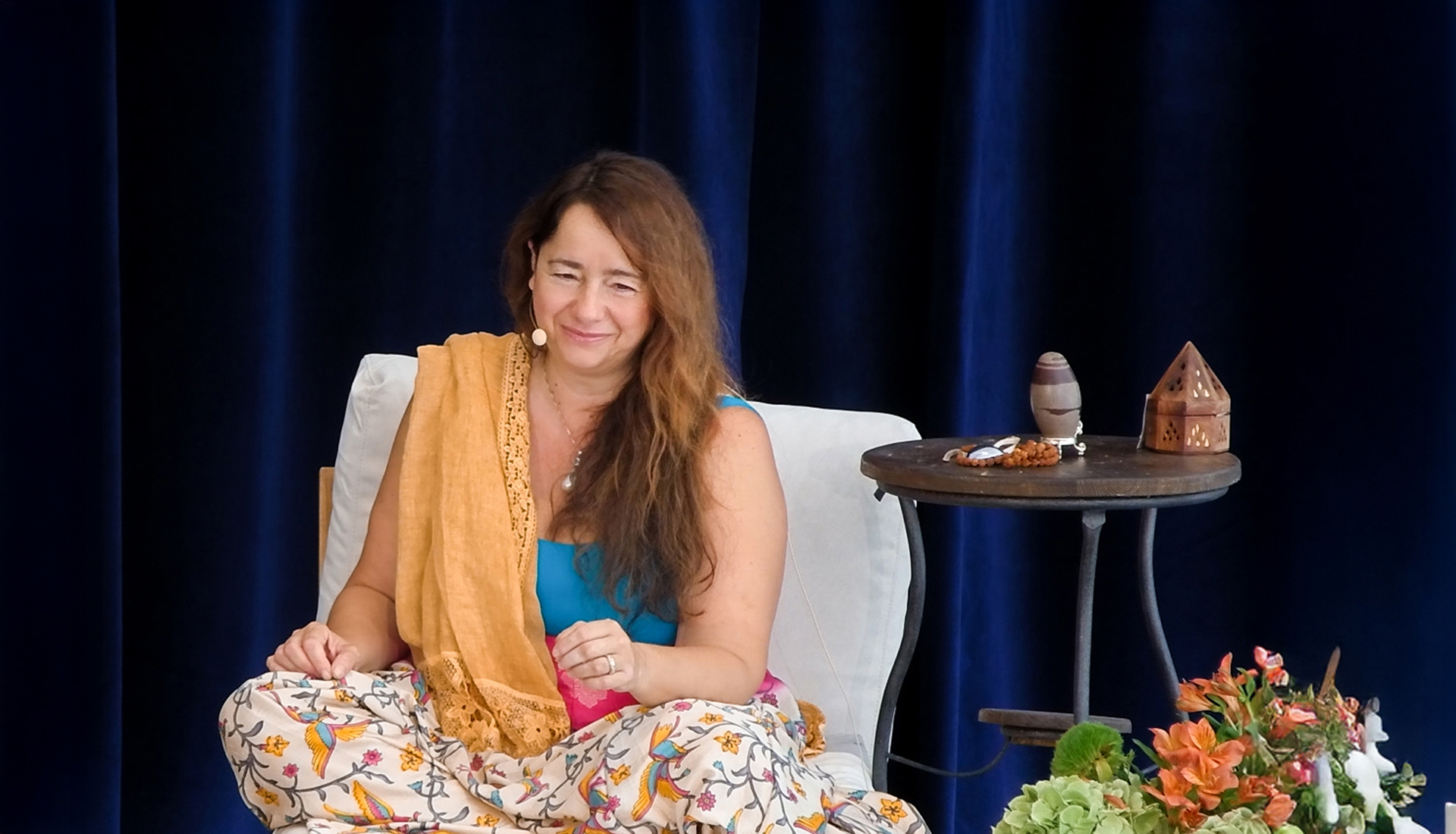 Shakti Caterina Maggi smiling as she is teaching in a retreat